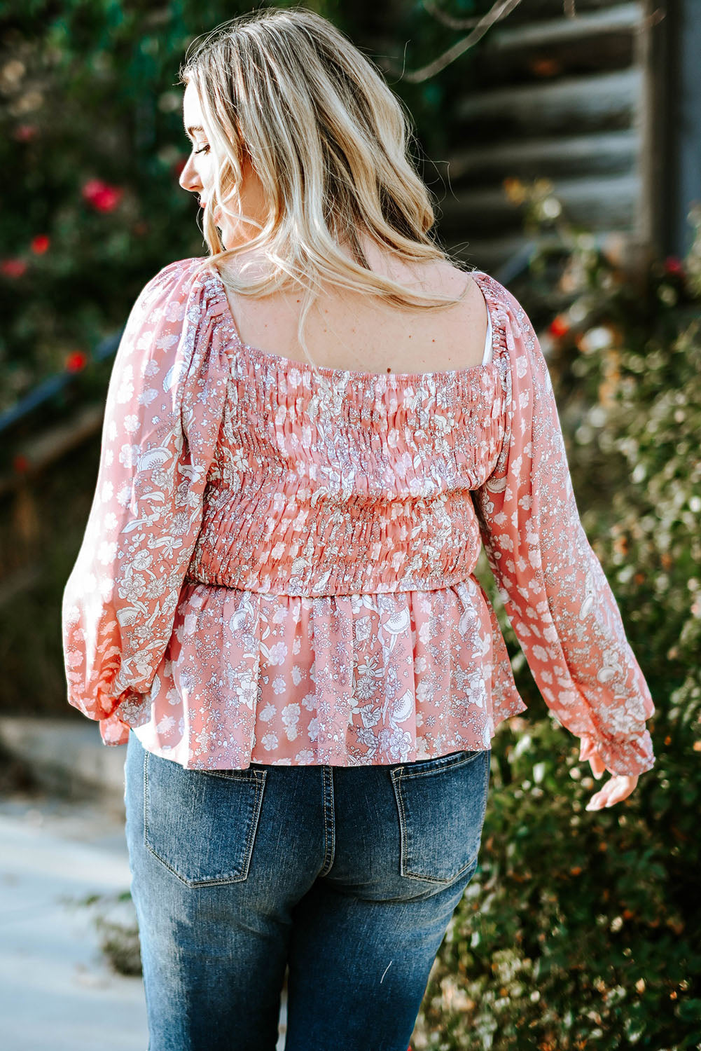 Boho-inspired Floral Blouse with Smocked Neckline and Bell Sleeves
