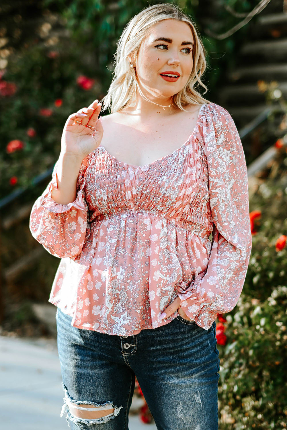 Boho-inspired Floral Blouse with Smocked Neckline and Bell Sleeves